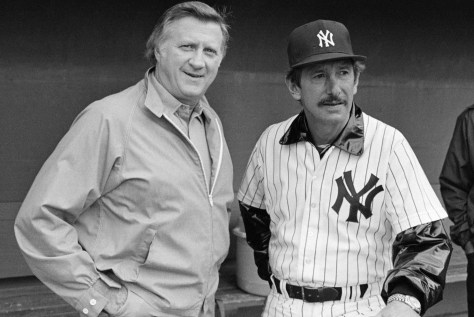 In this March 1, 1983, file photo, New York Yankees owner George Steinbrenner, left, and manager Billy Martin, get together outside the dugout at baseball spring training in Fort Lauderdale, Fla. Steinbrenner will be on the Hall of Fame veterans committee ballot next month with Martin. Steinbrenner owned the Yankees from 1973 until his death in July, and the team won seven World Series championships, 11 AL pennants and 16 AL East titles during his turbulent and blustery reign. Martin had five stints as Yankees manager under Steinbrenner, who fired him four times and let him resign once. (AP Photo/Ray Howard, File)
