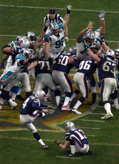 The Patriots' Adam Vinatieri kicks the game winning field goal Sunday night Feb. 1, 2004 during Superbowl XXXVIII. They beat the Carolina Panthers 32-29. 2/1/04 (STEVE CAMPBELL, STAFF/HEARST NEWSPAPERS - HOUSTON CHRONICLE)
